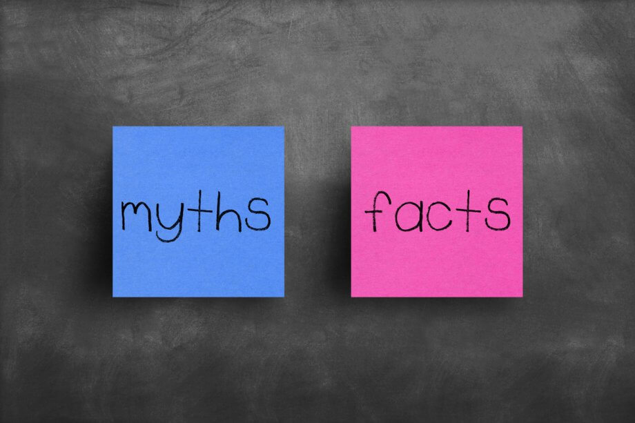 Photograph of two sticky notes side by side. The one on the left says "myths" the one on the right says "facts".