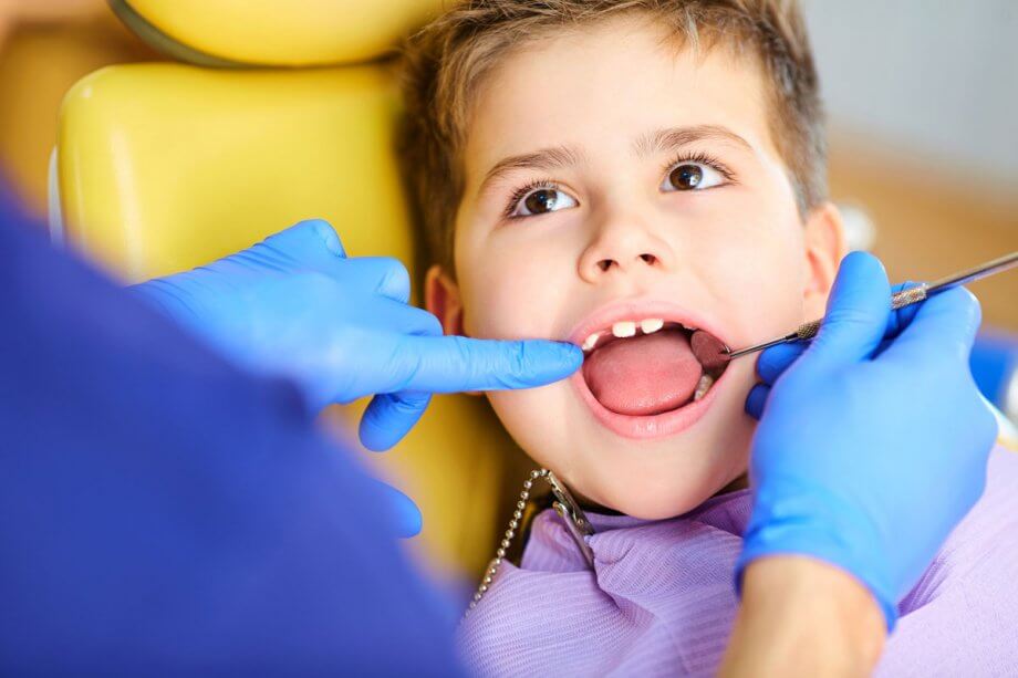 preschool boy in chair getting a dental exam